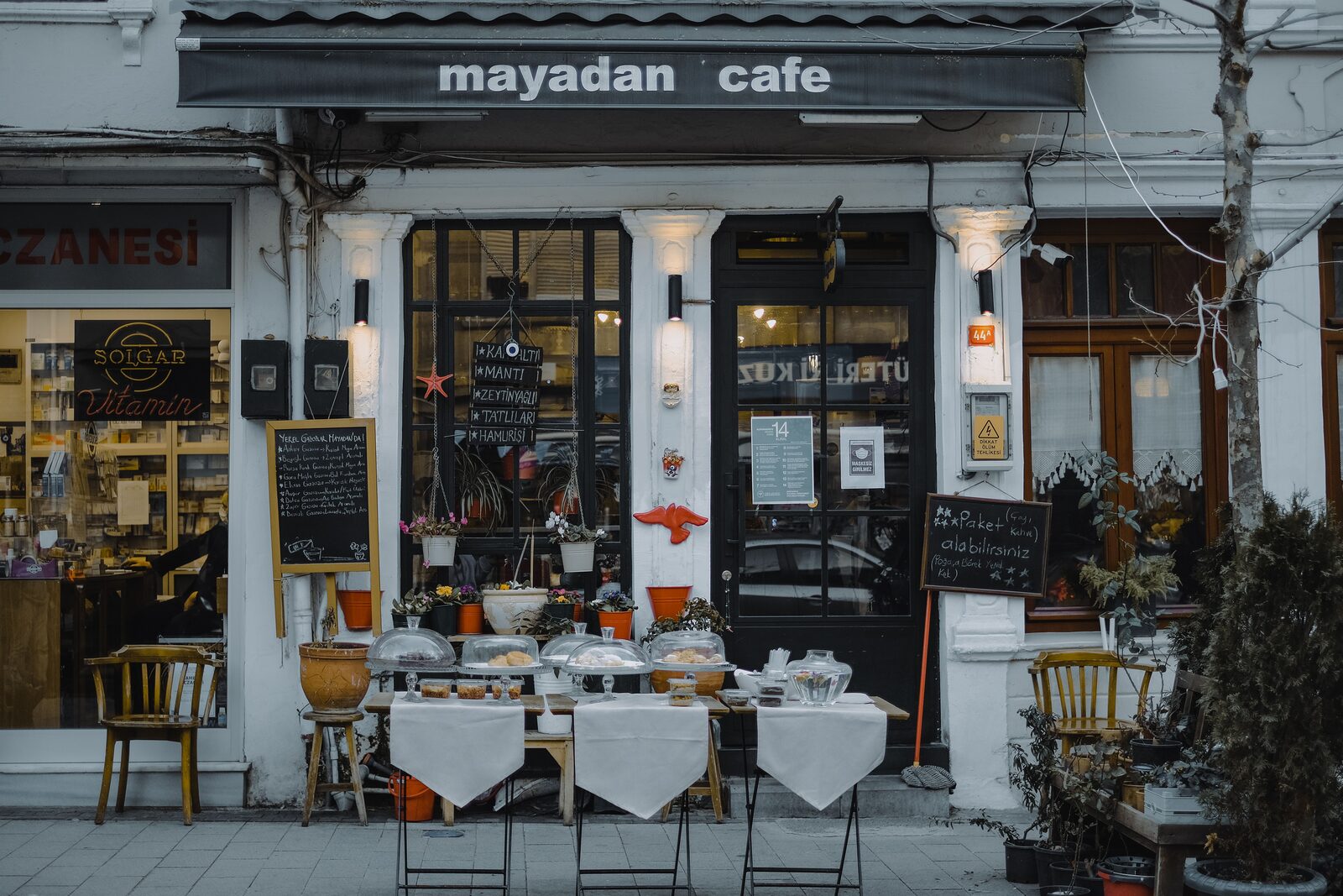 Small business owner running their own local SEO audit with a laptop, checklist, and map
